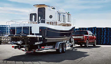 2022 Nissan TITAN Truck towing boat | Friendship Nissan of Boone in Boone NC